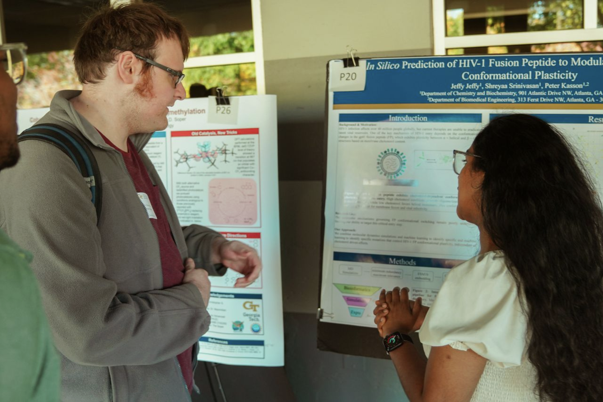 Alex and Jeffy discussing her poster