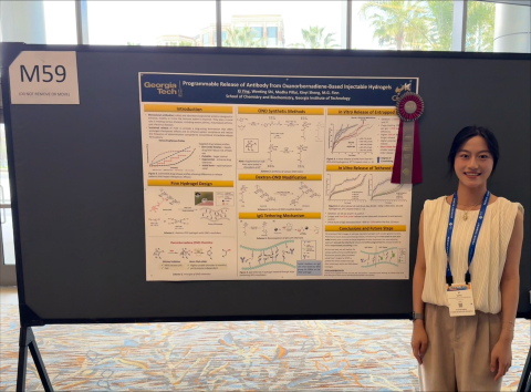 Wenting poses with her poster.
